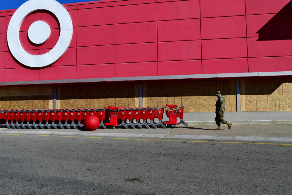 A member of the National Guard walks outside a Target store, initially aggravated by the unrest following the killing of black man Walter Wallace Jr., in Philadelphia, Pennsylvania, US November 4, 2020. REUTERS/Mark Makela TPX IMAGES OF THE DAY